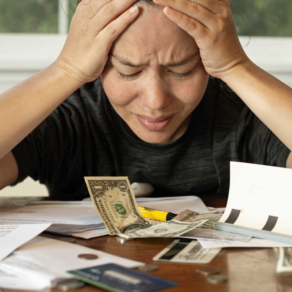 A female stressed about financial situation.  I can help alleviate your financial burden.